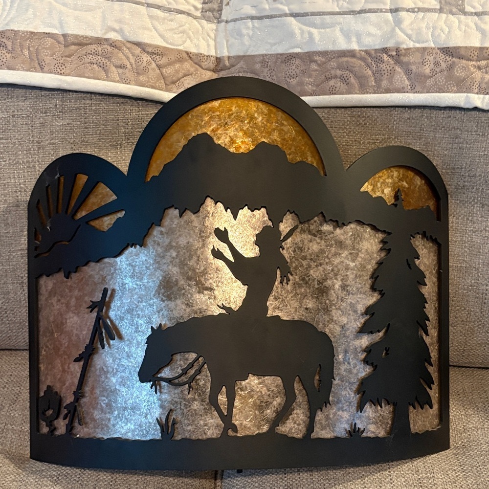New west of Cody, Wyoming Western mica Silhouette Black and Gold wall sconce.
